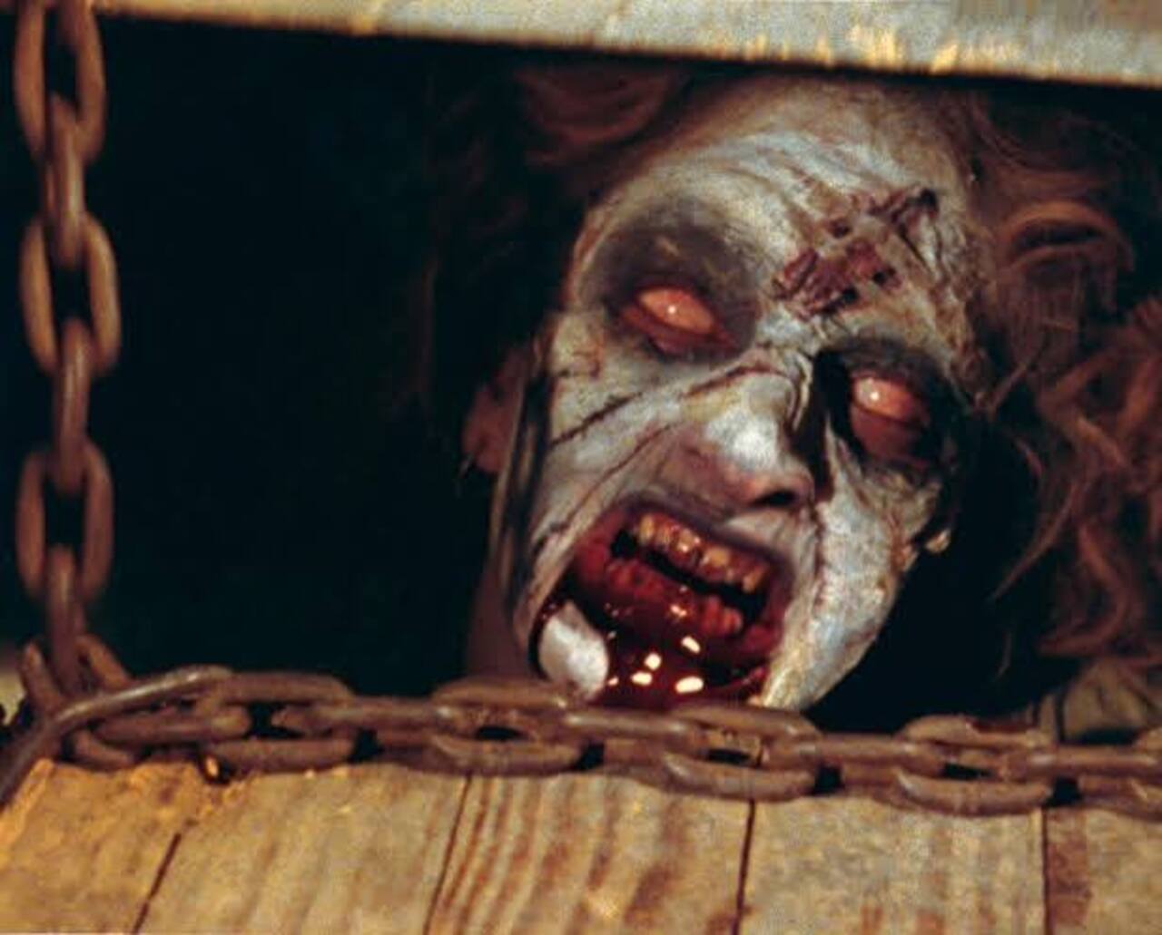 Evil Dead (1981)
The original classic introduces Ash Williams and the dreaded Book of the Dead. Five friends go to a remote cabin in the woods where they play a tape with incantations, which releases the demons that possess them one-by-one until only one is left fighting for survival.